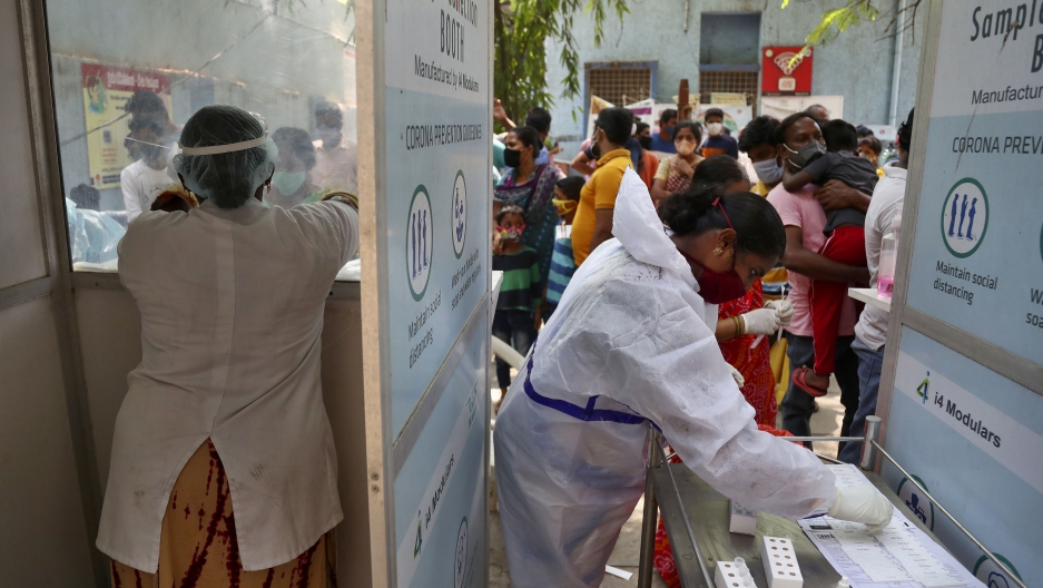 People wait their turn to get tested for COVID-19 in Hyderabad, India, April 25, 2021. People wait their turn to get tested for COVID-19 in Hyderabad, India, April 25, 2021.