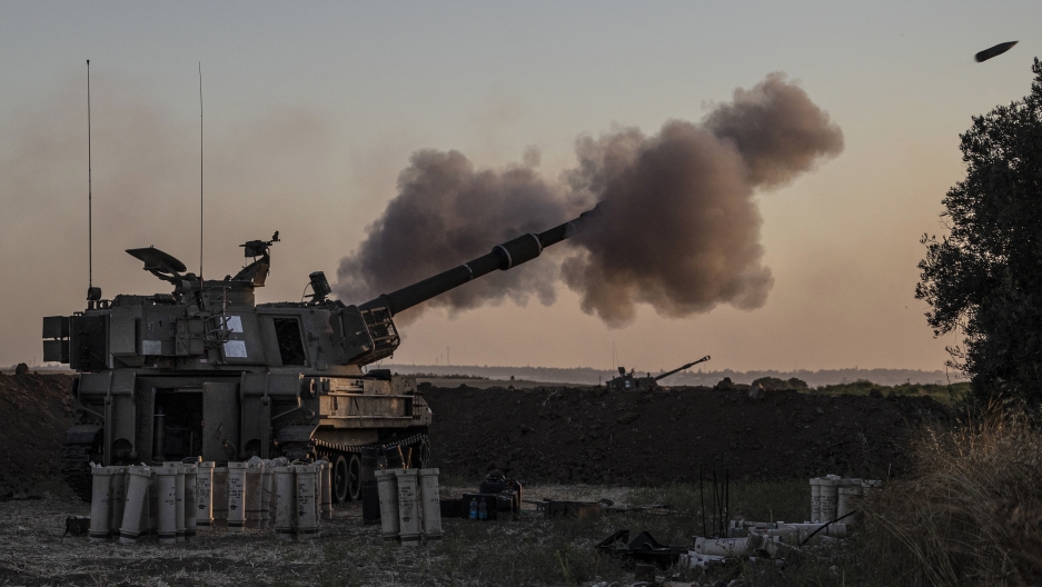 An Israeli artillery unit fires toward targets in Gaza Strip, at the Israel-Gaza border, Tuesday, May 18, 2021. An Israeli artillery unit fires toward targets in Gaza Strip, at the Israel-Gaza border, Tuesday, May 18, 2021.