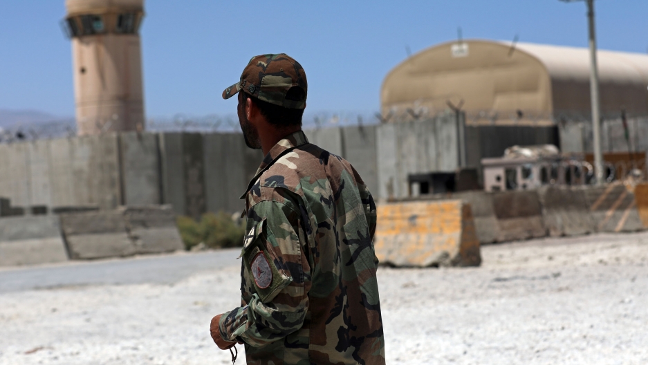 An Afghan Army soldier stand guard at the gate of Bagram Air Base in Afghanistan, Friday, June 25, 2021. In 2001, the armies of the world united behind America and Bagram Air Base. It’s now nearly 20 years later and the last US soldiers have exited. A soldier stands guard at the gate of Bagram Air Base.