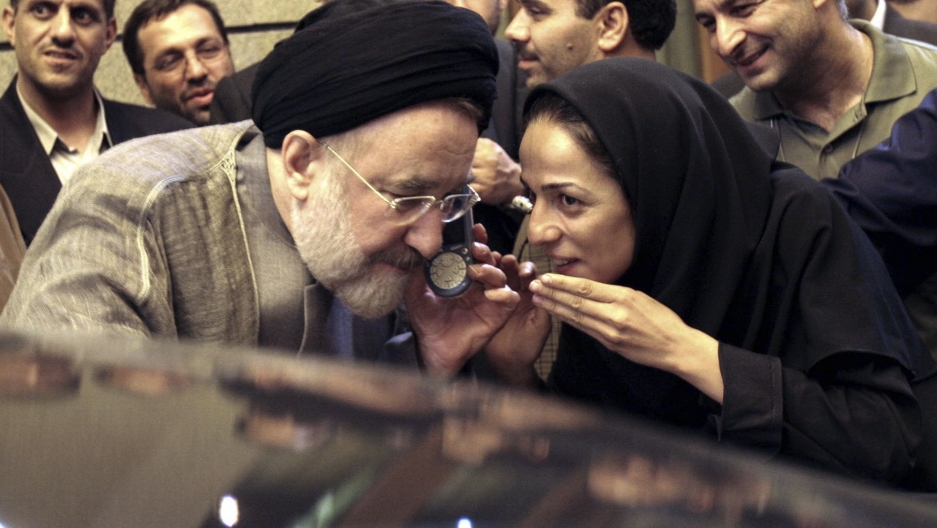 Outgoing reformist Iranian President Mohammad Khatami talks on the phone with the mother of female journalist Masih Alinejad, right, after meeting with journalists in Tehran, Iran, July 13, 2005. Outgoing reformist Iranian President Mohammad Khatami talks on the phone with the mother of female journalist Masih Alinejad, right, after meeting with journalists in Tehran, Iran, July 13, 2005.