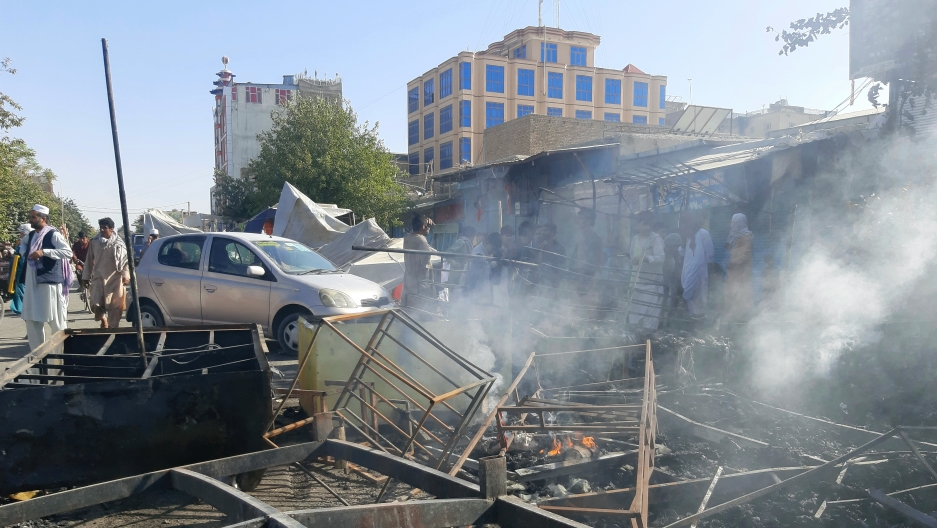 Smoke rises from damaged shops after fighting between Taliban and Afghan security forces in Kunduz city, northern Afghanistan, Aug. 8, 2021. Smoke rises from damaged shops after fighting between Taliban and Afghan security forces in Kunduz city, northern Afghanistan, Aug. 8, 2021.