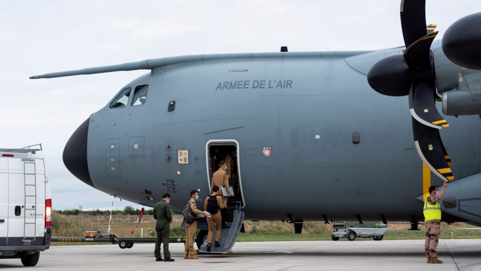 In this photo provided by the French Defense Ministry, French soldiers board a military Airbus A400M to evacuate French citizens from Afghanistan, Monday, Aug.16, 2021 in Orleans, central France. In this photo provided by the French Defense Ministry, French soldiers board a military Airbus A400M to evacuate French citizens from Afghanistan, Monday, Aug.16, 2021 in Orleans, central France.