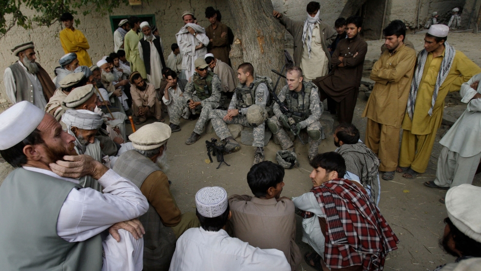 Lt. Thomas Goodman meets with villagers in Qatar Kala in the Pech Valley of Afghanistan's Kunar province with his interpreter Ayazudin Hilal. Lt. Thomas Goodman meets with villagers in Qatar Kala in the Pech Valley of Afghanistan's Kunar province with his interpreter Ayazudin Hilal.