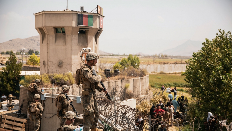 In this image provided by the US Marine Corps, Marines assist with security at an evacuation control checkpoint during an evacuation at Hamid Karzai International Airport in Kabul, Afghanistan, Friday, Aug. 20, 2021. In this image provided by the US Marine Corps, Marines assist with security at an evacuation control checkpoint during an evacuation at Hamid Karzai International Airport in Kabul, Afghanistan, Friday, Aug. 20, 2021.
