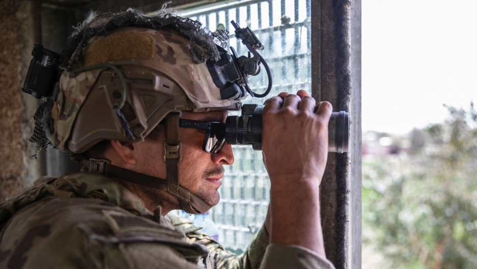 In this image provided by the US Army, a paratrooper assigned to B Company, 2nd Battalion, 501st Parachute, Infantry Regiment, 1st Brigade Combat Team, 82nd Airborne Division conducts security at Hamid Karzai International Airport in Kabul, Afghanistan. A paratrooper assigned to B Company, 2nd Battalion, 501st Parachute, Infantry Regiment, 1st Brigade Combat Team, 82nd Airborne Division conducts security at Hamid Karzai International Airport in Kabul, Afghanistan.