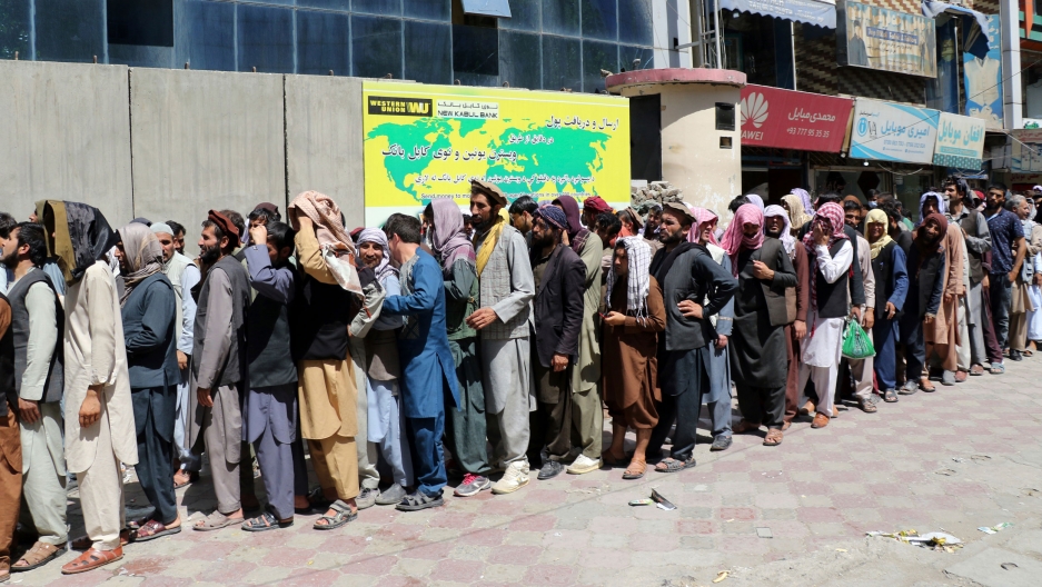 Afghans wait in front of Kabul Bank, in Kabul, Afghanistan, Wednesday, Aug. 25, 2021. Afghans wait in front of Kabul Bank, in Kabul, Afghanistan, Wednesday, Aug. 25, 2021.