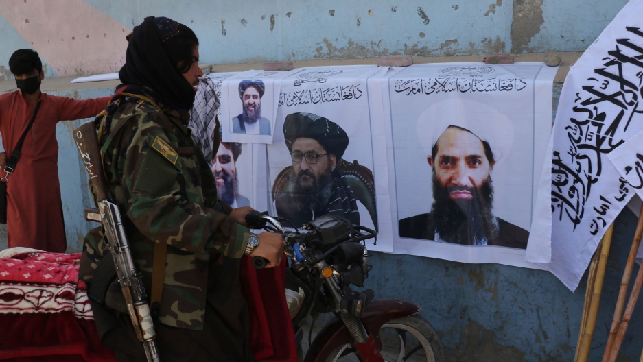 Taliban fighter looks at Taliban flags and posters of leaders in Kabul, Afghanistan, Wednesday, Aug. 25, 2021. Taliban fighter looks at Taliban flags and posters of leaders in Kabul, Afghanistan, Wednesday, Aug. 25, 2021.