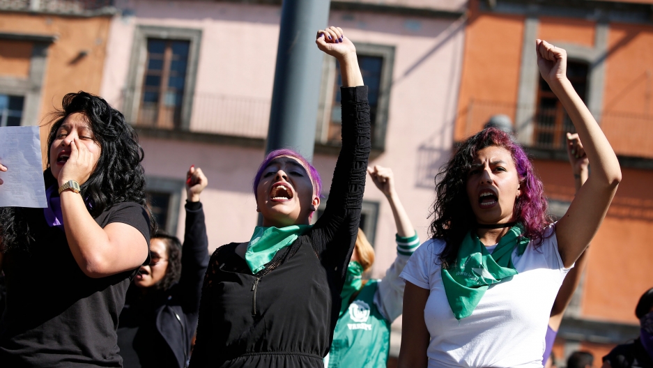 Perla Rosales, 26, center, and Marian Lira, 24, right, participate in a performance in support of abortion rights next to the cathedral in Mexico City, Sunday, Jan. 5, 2020. Perla Rosales, 26, center, and Marian Lira, 24, right, participate in a performance in support of abortion rights next to the cathedral in Mexico City, Sunday, Jan. 5, 2020.