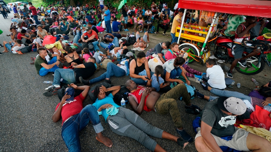 Migrants who are part of a large group heading north stop to rest along the Huehuetan highway, Chiapas state, Mexico, Saturday, Sept. 4, 2021. Migrants who are part of a large group heading north stop to rest along the Huehuetan highway, Chiapas state, Mexico, Saturday, Sept. 4, 2021.