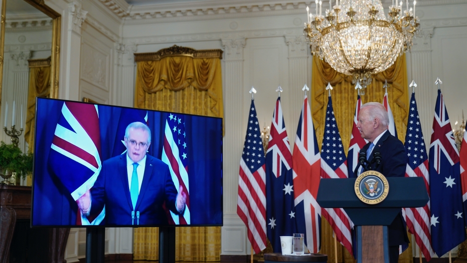 President Joe Biden listens as he is joined virtually by Australian Prime Minister Scott Morrison and British Prime Minister Boris Johnson, not seen, as he speaks about a national security initiative from the East Room of the White House in Washington, Se President Joe Biden listens as he is joined virtually by Australian Prime Minister Scott Morrison and British Prime Minister Boris Johnson, not seen, as he speaks about a national security initiative from the East Room of the White House in Washington, Se