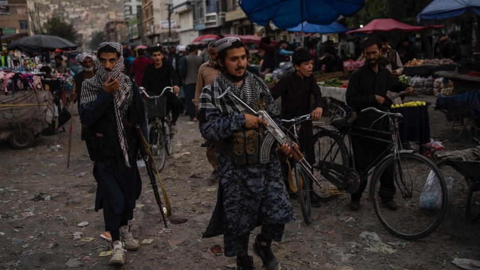 Taliban fighters patrol a market in Kabul's Old City, Afghanistan, Sept. 14, 2021. Taliban fighters patrol a market in Kabul's Old City, Afghanistan, Sept. 14, 2021.