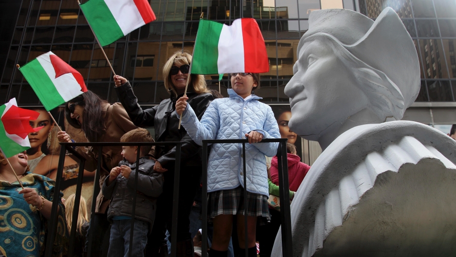 People ride on a float with a large bust of Christopher Columbus during the Columbus Day parade in New York, Oct. 8, 2012. The Oct. 12 federal holiday dedicated to Christopher Columbus continues to divide those who view the explorer as a representative of People ride on a float with a large bust of Christopher Columbus during the Columbus Day parade in New York, Oct. 8, 2012. The Oct. 12 federal holiday dedicated to Christopher Columbus continues to divide those who view the explorer as a representative of