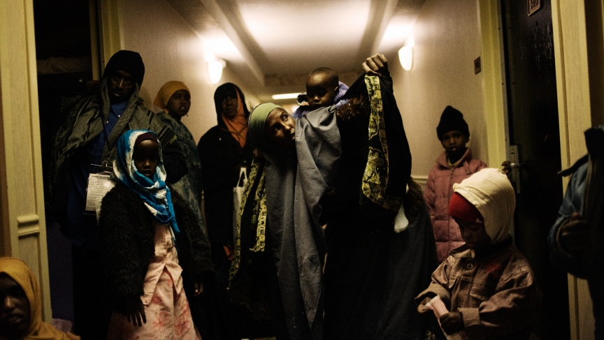Despite the care provided by the International Organization for Migration, Somali refugees opted to spend the night in a hotel hallway. Some of them feared being left behind on their trip to their resettlement destination. December, 11, 2009. Despite the care provided by the International Organization for Migration, Somali refugees opted to spend the night in a hotel hallway. Some of them feared being left behind on their trip to their resettlement destination. December, 11, 2009.