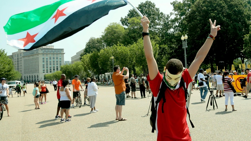 Fouad Faris carries a Free Syrian Army flag at a protest in Washington, D.C. against the Syrian military's use of chemical weapons. Fouad Faris carries a Free Syrian Army flag at a protest in Washington, D.C. against the Syrian military's use of chemical weapons.