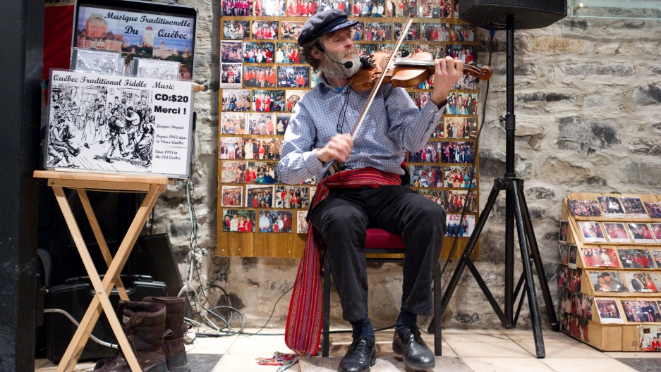 Folklorist and musician Jacques Dupuis performing at the latest incarnation of the Voûte à 'Ti-Père, a Caribou-drinking institution in Quebec. On cold days, Caribou “gets you very, very, very warm,” he says. “It was so good, I quit drinking it.” Folklorist and musician Jacques Dupuis performing at the latest incarnation of the Voûte à 'Ti-Père, a Caribou-drinking institution in Quebec. On cold days, Caribou “gets you very, very, very warm,” he says. “It was so good, I quit drinking it.”