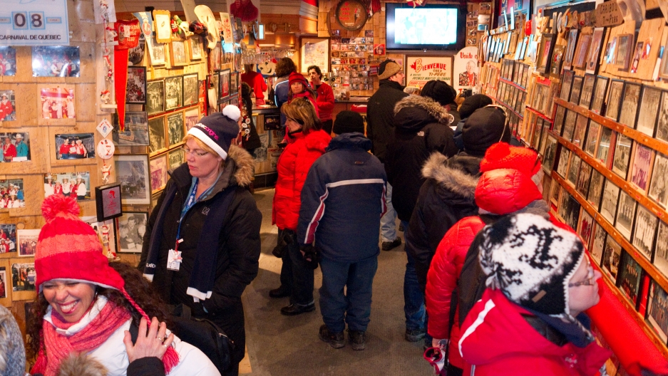 Visitors peruse a photo exhibit of homemade Caribou's long and checkered history at the Voûte à 'Ti-Père, a reconstruction of a storied Caribou drinking spot. “I think it was stronger back then,” says bartender Richard Le Blanc. “It's in the basement, and Visitors peruse a photo exhibit of homemade Caribou's long and checkered history at the Voûte à 'Ti-Père, a reconstruction of a storied Caribou drinking spot. “I think it was stronger back then,” says bartender Richard Le Blanc. “It's in the basement, and