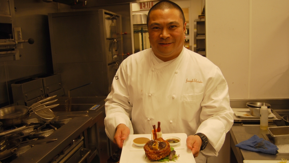 Joseph Elevado, head chef at Andrea's, holds a plate of crispy pork shank known as pata, a dish served Filipino style. His menu offers a variety of Asian dishes including Chinese, Japanese, Thai and Filipino foods. Joseph Elevado, head chef at Andrea's, holds a plate of crispy pork shank known as pata, a dish served Filipino style. His menu offers a variety of Asian dishes including Chinese, Japanese, Thai and Filipino foods.