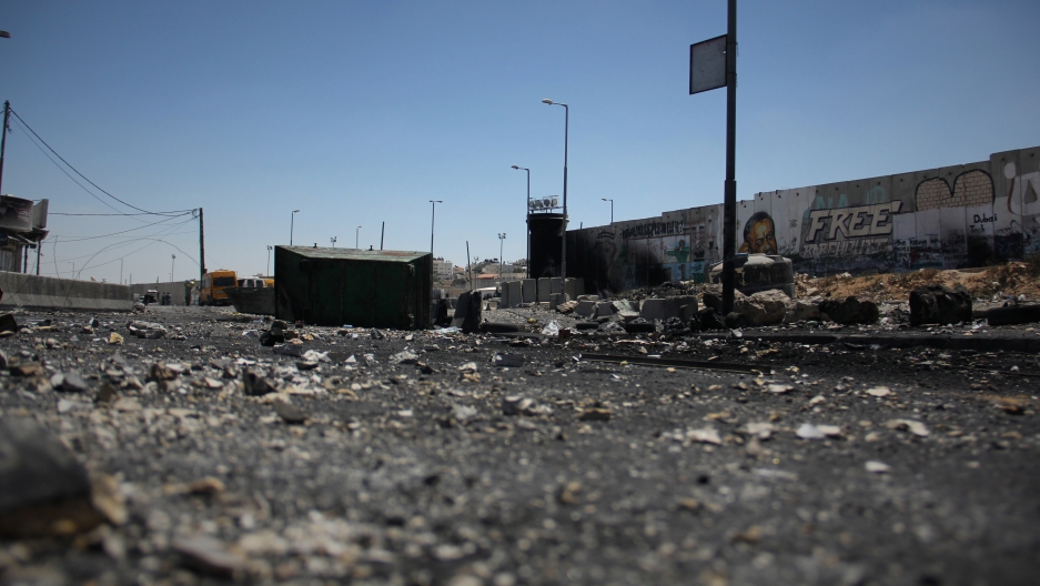 The charred Qalandiya checkpoint after clashes between protesters and the Israeli army. The charred Qalandiya checkpoint after clashes between protesters and the Israeli army.