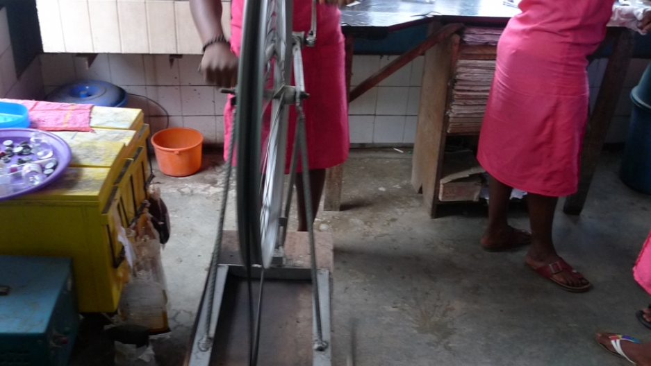 The clinic is famous for simple, locally constructed medical equipment. Here, a nurse operates a hematocrit centrifuge made from bicycle parts to separate plasma from red blood cells. The clinic is famous for simple, locally constructed medical equipment. Here, a nurse operates a hematocrit centrifuge made from bicycle parts to separate plasma from red blood cells.