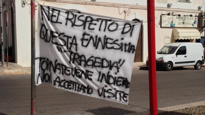 Locals put up signs throughout Lampedusa to protest the visit of politicians who came after the shipwreck. More than 350 people -mostly from the African nation of Eritrea- lost their lives. Many Lampedusans protested the lack of resources and support from Locals put up signs throughout Lampedusa to protest the visit of politicians who came after the shipwreck. More than 350 people -mostly from the African nation of Eritrea- lost their lives. Many Lampedusans protested the lack of resources and support from