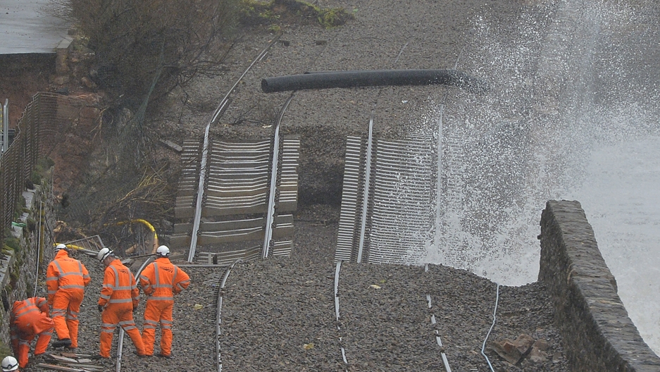 Rail emergency workers inspect damaged tracks along the seafront at Dawlish in south-west England February 6, 2014. Storms destroyed sections of the mainline route to the south-west of England, and severe weather warnings for rain and gale force winds hav Rail emergency workers inspect damaged tracks along the seafront at Dawlish in south-west England February 6, 2014. Storms destroyed sections of the mainline route to the south-west of England, and severe weather warnings for rain and gale force winds hav