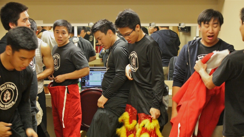 Lion dancers get ready in their dressing room before they perform "Paris by Night" in Southern California. Lion dancers get ready in their dressing room before they perform "Paris by Night" in Southern California.