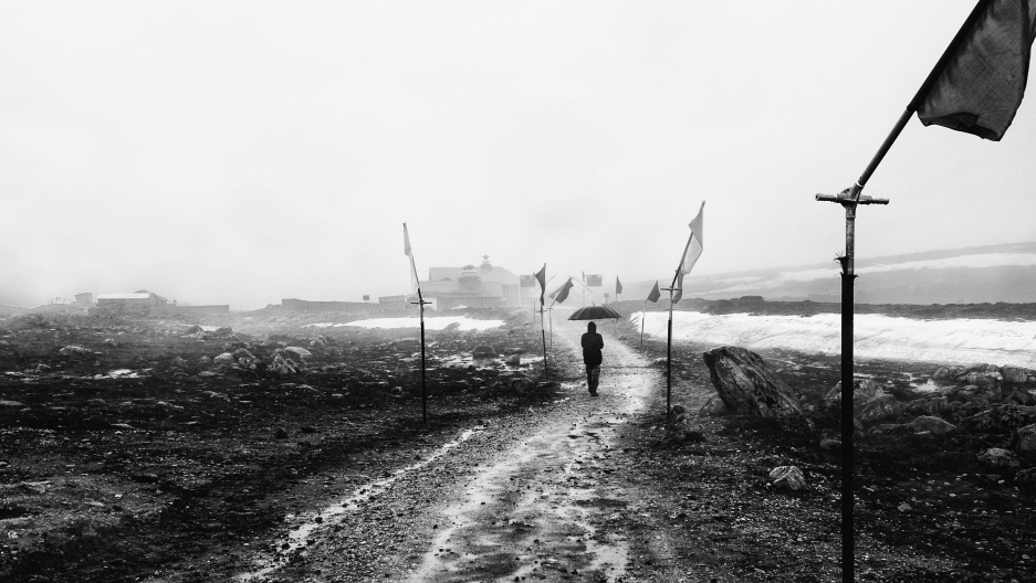 An Indian soldier walks along Bum La Pass, in an "no man's land" area, where both China and India have laid claim. An Indian soldier walks along Bum La Pass, in an "no man's land" area, where both China and India have laid claim.