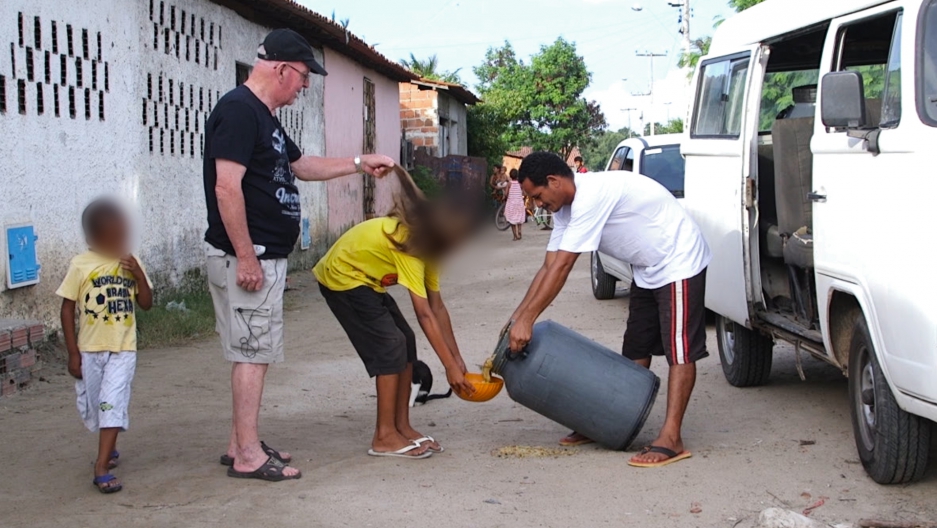 South America Has Become A Safe Haven For The Catholic Church S Accused Child Abuser Father Jan Van Dael Plays With The Hair Of A Boy Collecting