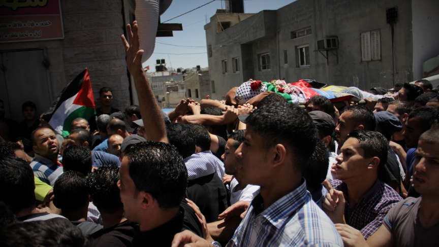 Palestinians carry the body of 17-year-old Mohammed Al-Araj through the streets of the Qalandiya refugee. He was killed in clashes with the Israeli Army. Palestinians carry the body of 17-year-old Mohammed Al-Araj through the streets of the Qalandiya refugee. He was killed in clashes with the Israeli Army.