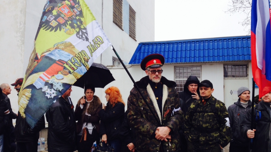 A group of Russia supporters outside the entrance to the Ukrainian naval headquarters in Sevastopol. They say they see Crimea's future with Russia, not Ukraine.