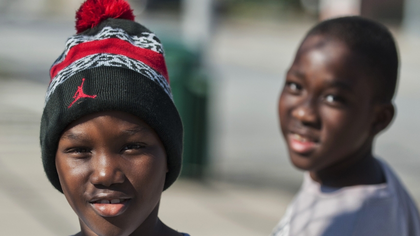 Young residents pose for a photograph on a street in the Clifton neighborhood of Staten Island in New York on October 25, 2014. The area is home to a community known as "Little Liberia" — it has the largest concentration of Liberians outside of Africa.