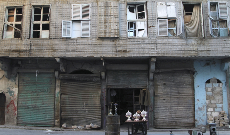 A boy selling antiques in Old Aleppo, January 2015. Archaeological treasures, thousands of years old, are being openly looted and traded In Syria and neighboring nations. 