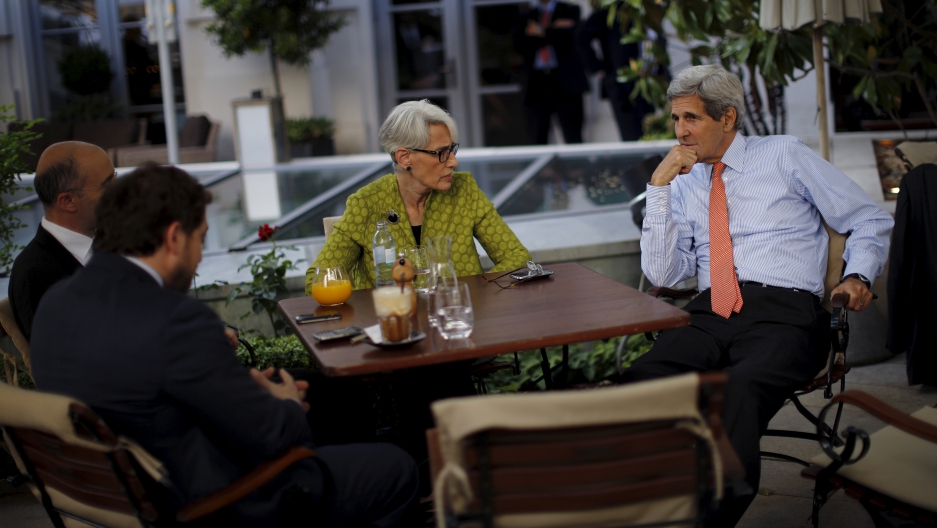 U.S. Secretary of State John Kerry (R), U.S. Under Secretary for Political Affairs Wendy Sherman (C), National Security Council point person on the Middle East Robert Malley (L) and Chief of Staff Jon Finer (2nd L) meet on the terrace of a hotel where the