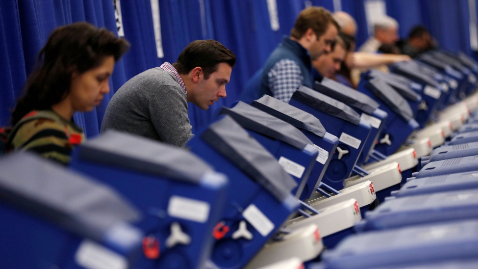 Voters casting ballots Voters casting ballots