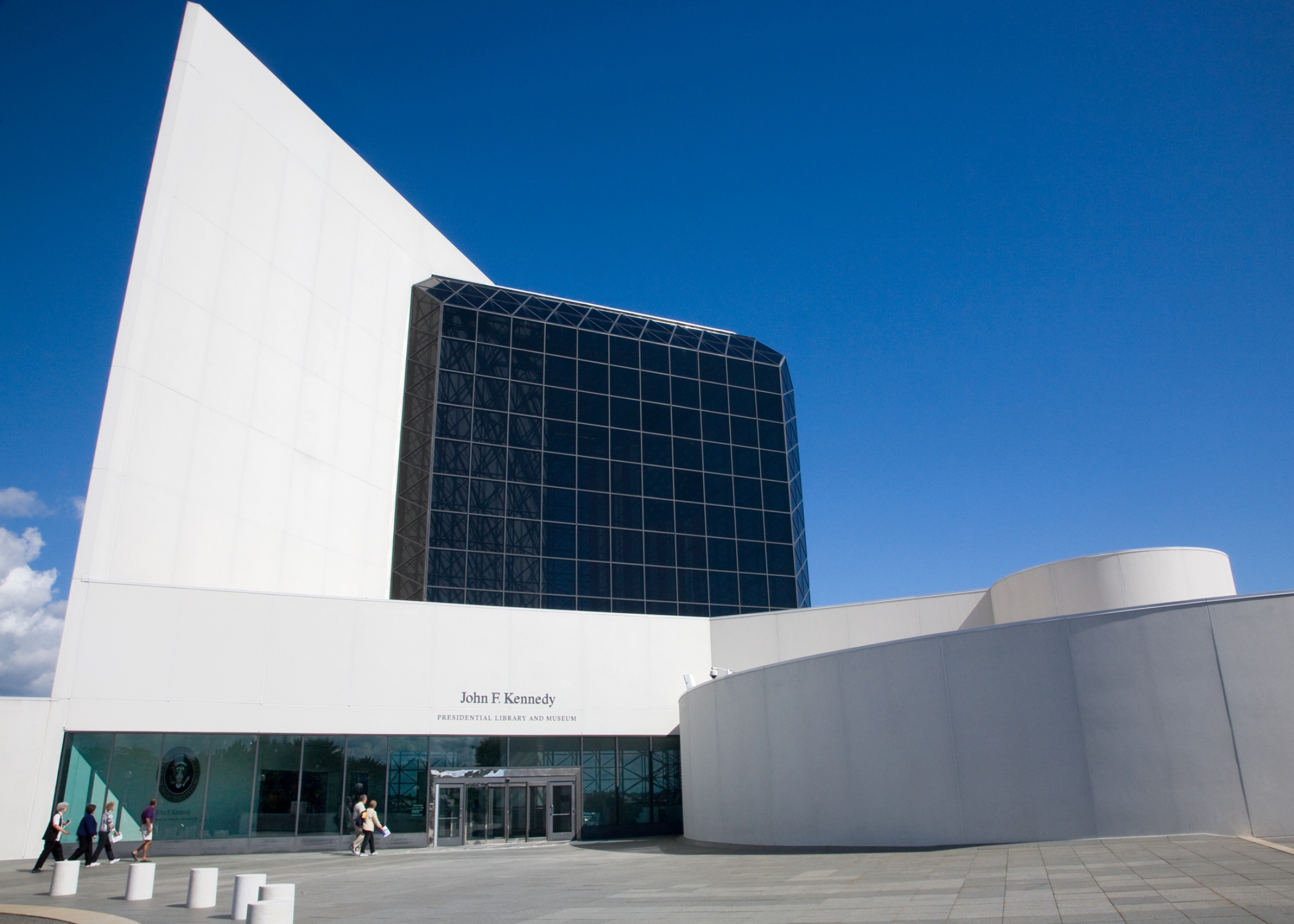 The John F. Kennedy Presidential Library and Museum was commissioned in December 1964 and finally completed in 1979. Located in Boston, Massachusetts, it is part of the United States Presidential Library System. The glass and and concrete John F. Kennedy Presidential Library and Museum on a sunny day.
