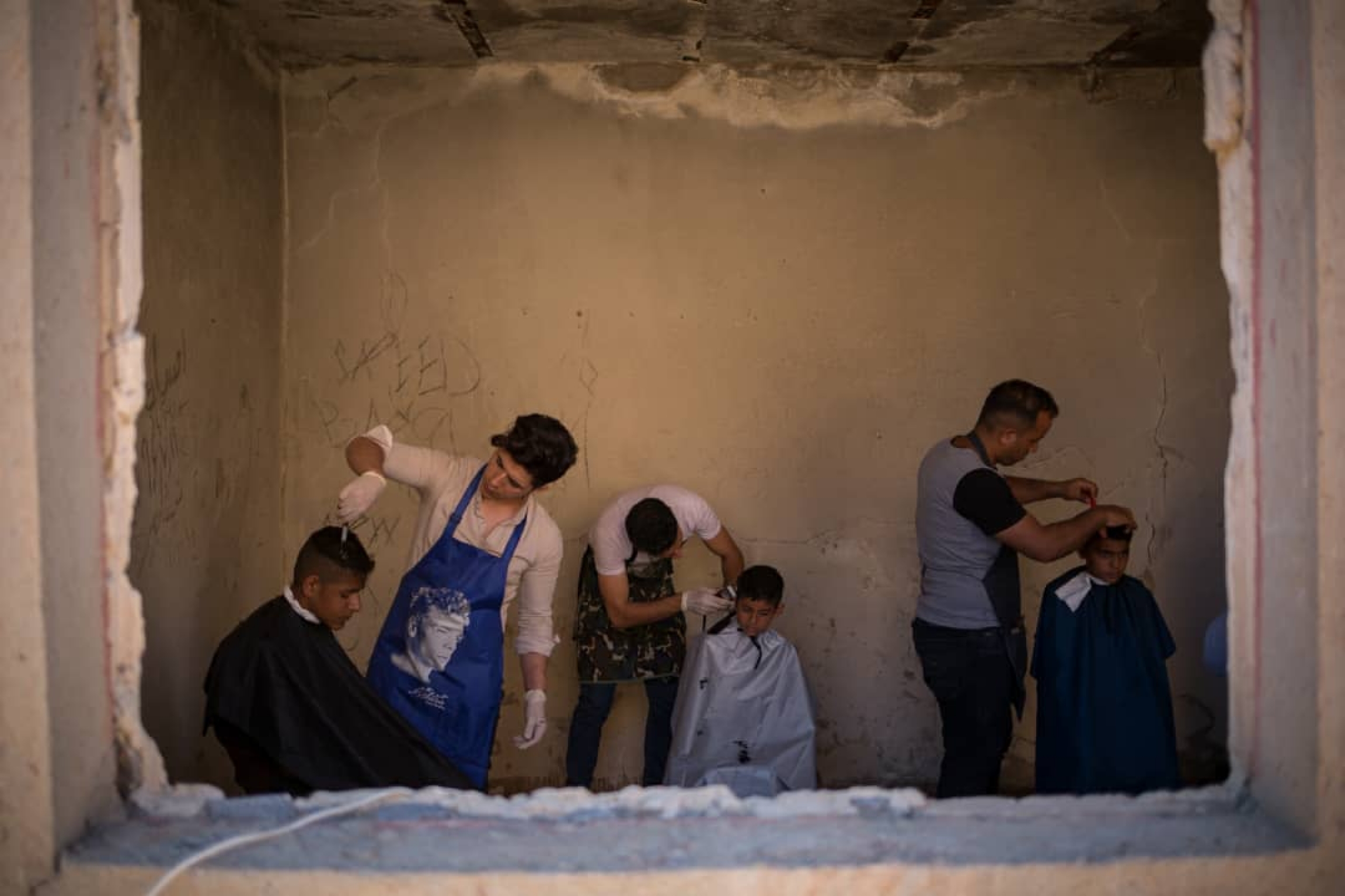 Young volunteers give free haircuts to survivors of floods in Khuzestan province in Western Iran. Young volunteers give free haircuts to survivors of floods in Khuzestan province in Western Iran.