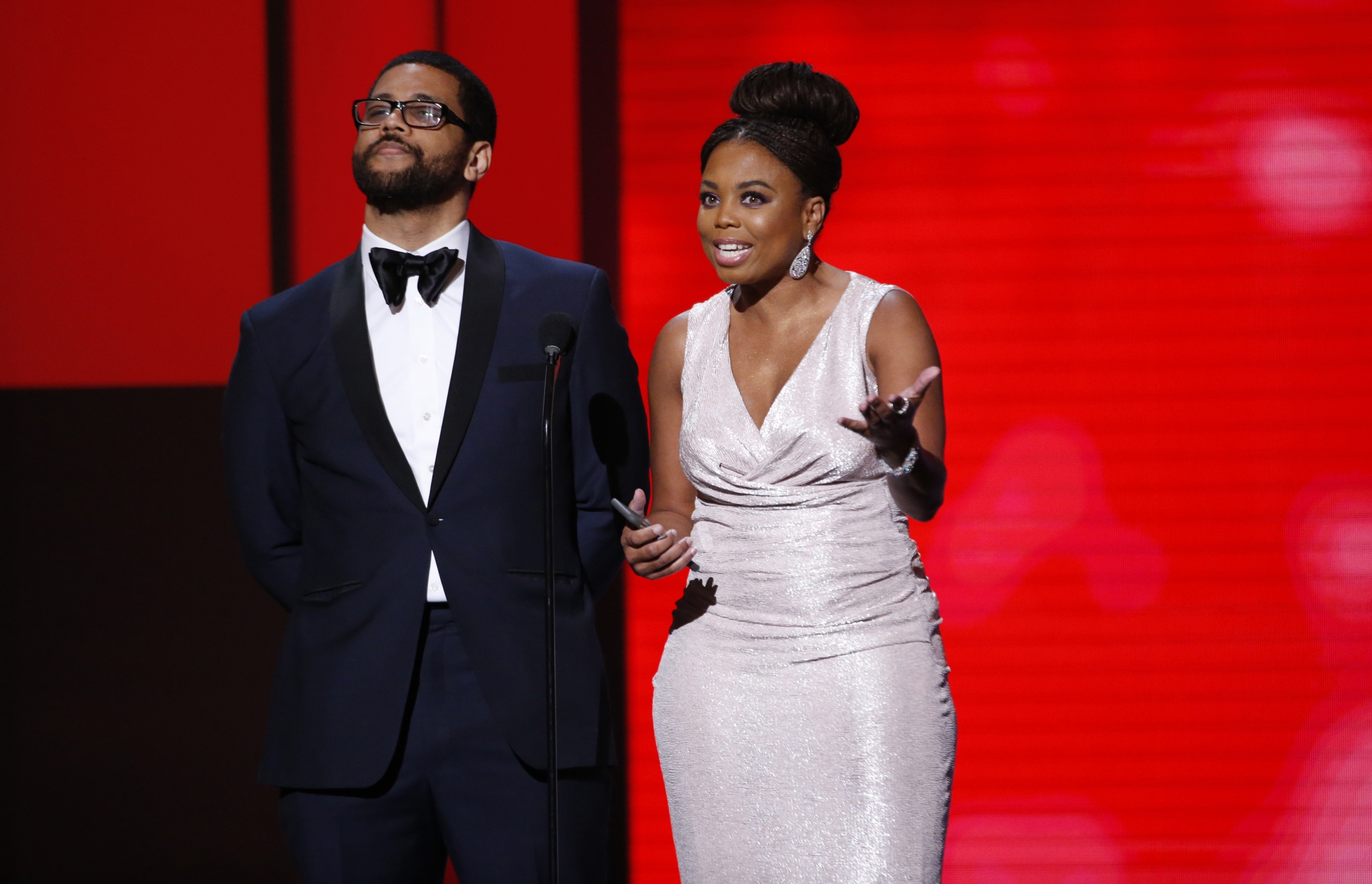 Presenters Jemele Hill and Michael Smith speak on stage at 49th NAACP Image Awards.