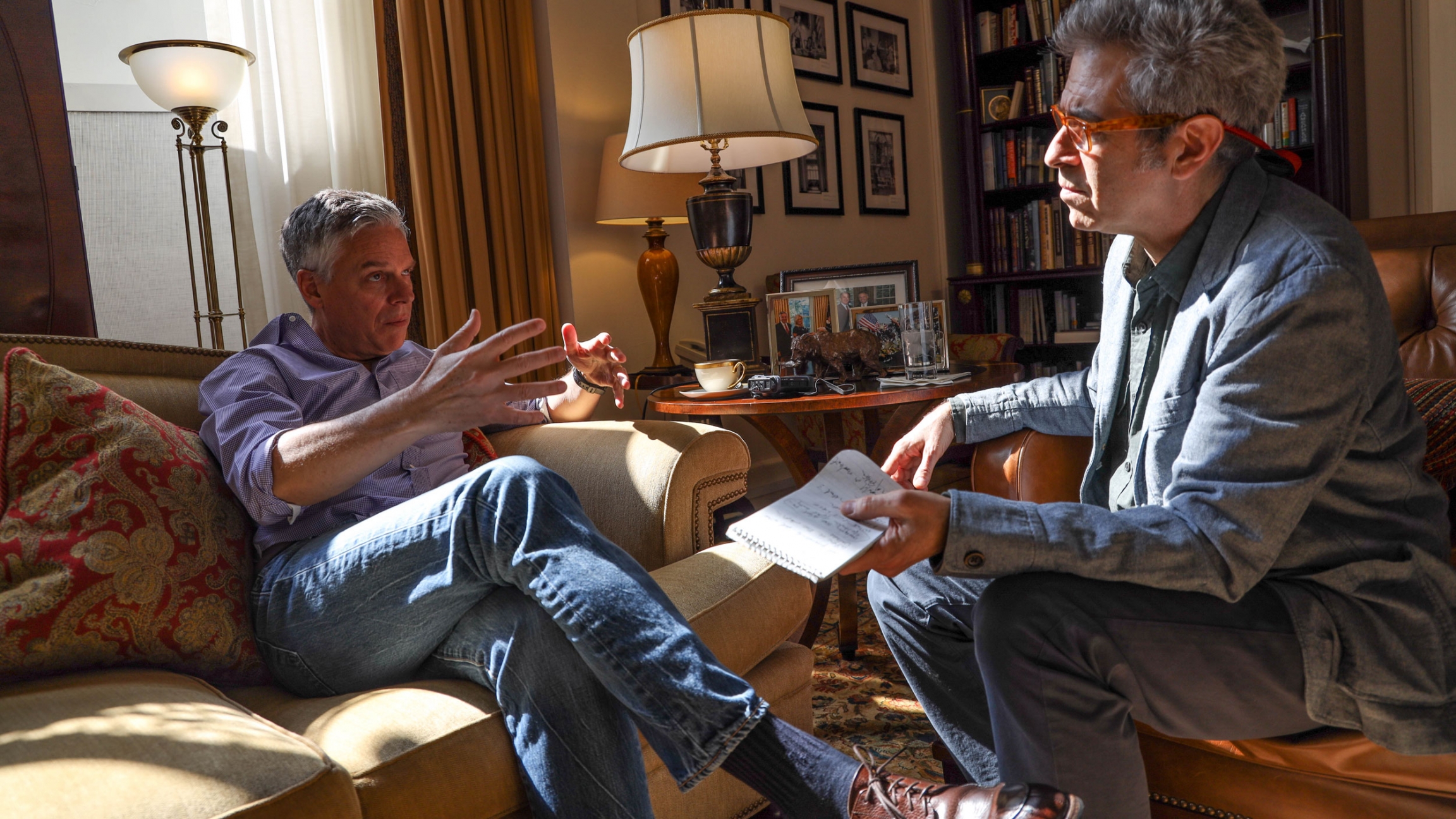 Ambassador Jon Huntsman Jr., the US' chief diplomat to Russia, sits down for an interview with The World's Marco Werman. Ambassador Jon Huntsman Jr. is shown in a button down shirt sitting across from Marco Werman who is wearing glasses.