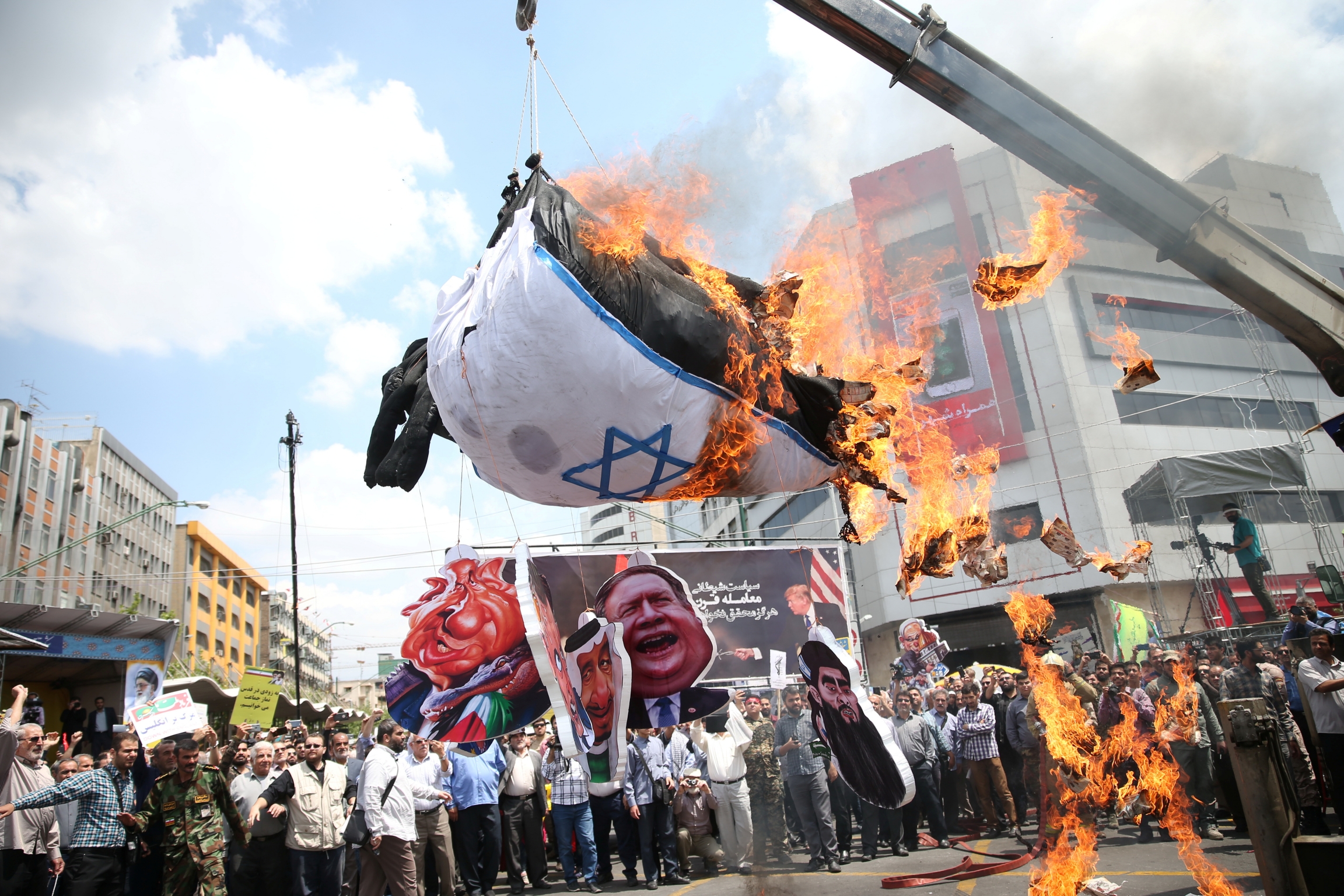 Iranians burn an Israeli flag during a protest marking the annual al-Quds Day (Jerusalem Day) on the last Friday of the holy month of Ramadan in Tehran, Iran May 31, 2019.
