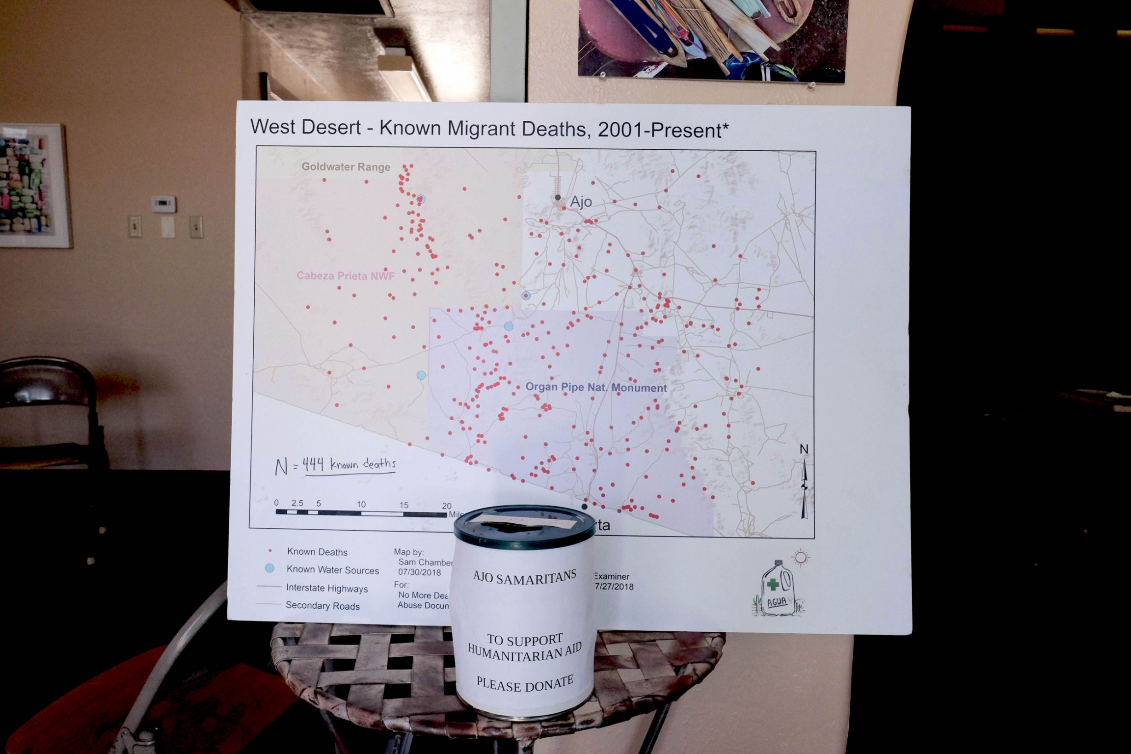 Inside the Ajo Humanitarian Aid Office is a map of the area that is covered in small red dots. Each dot marks the location where set of migrant remains were found and recorded by the Pima County Medical Examiner’s Office. A map shows the Arizona-Mexico border and is covered in red dots. Each dot marks a spot a person has died in the desert.