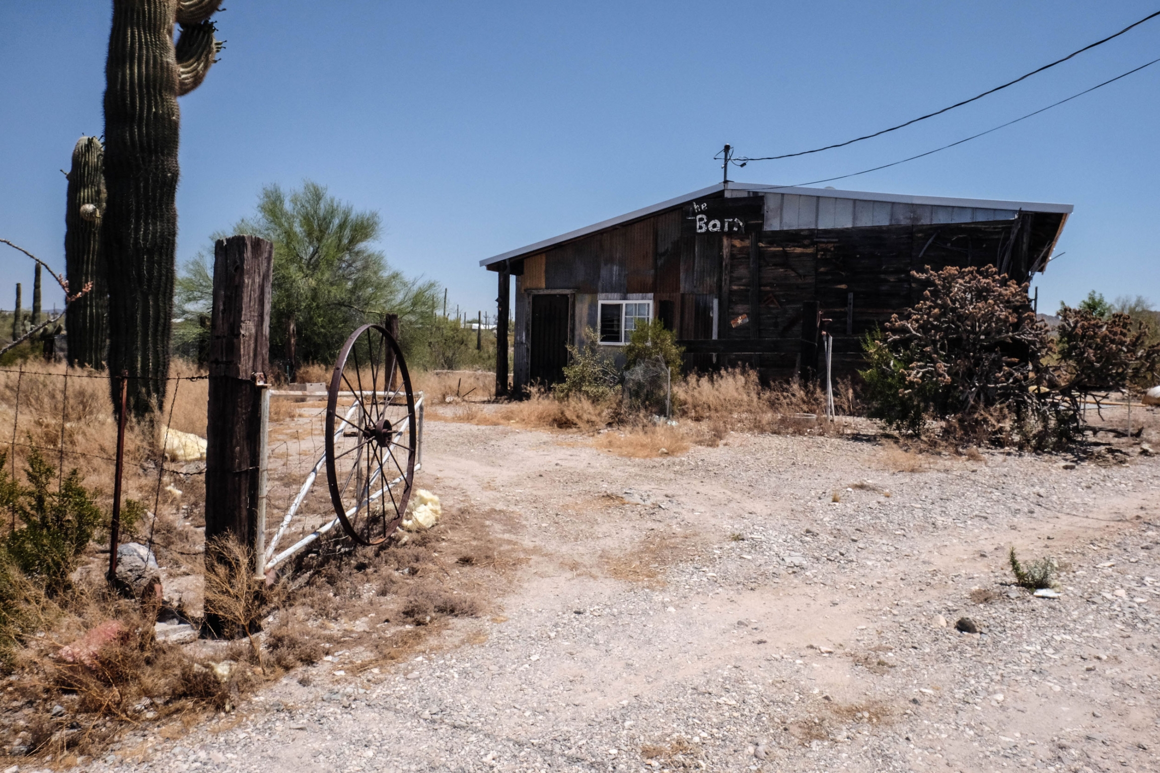 "The Barn" in Ajo, Arizona, where Scott Warren is accused of sheltering two undocumented men. A building made of rusting sheet metal has the words "The barn" painted in white paint