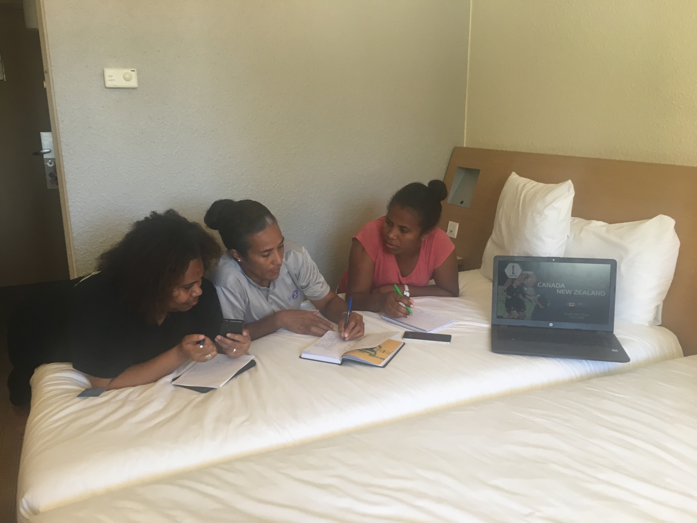 three women from the Pacific Islands prepare for a World Cup match