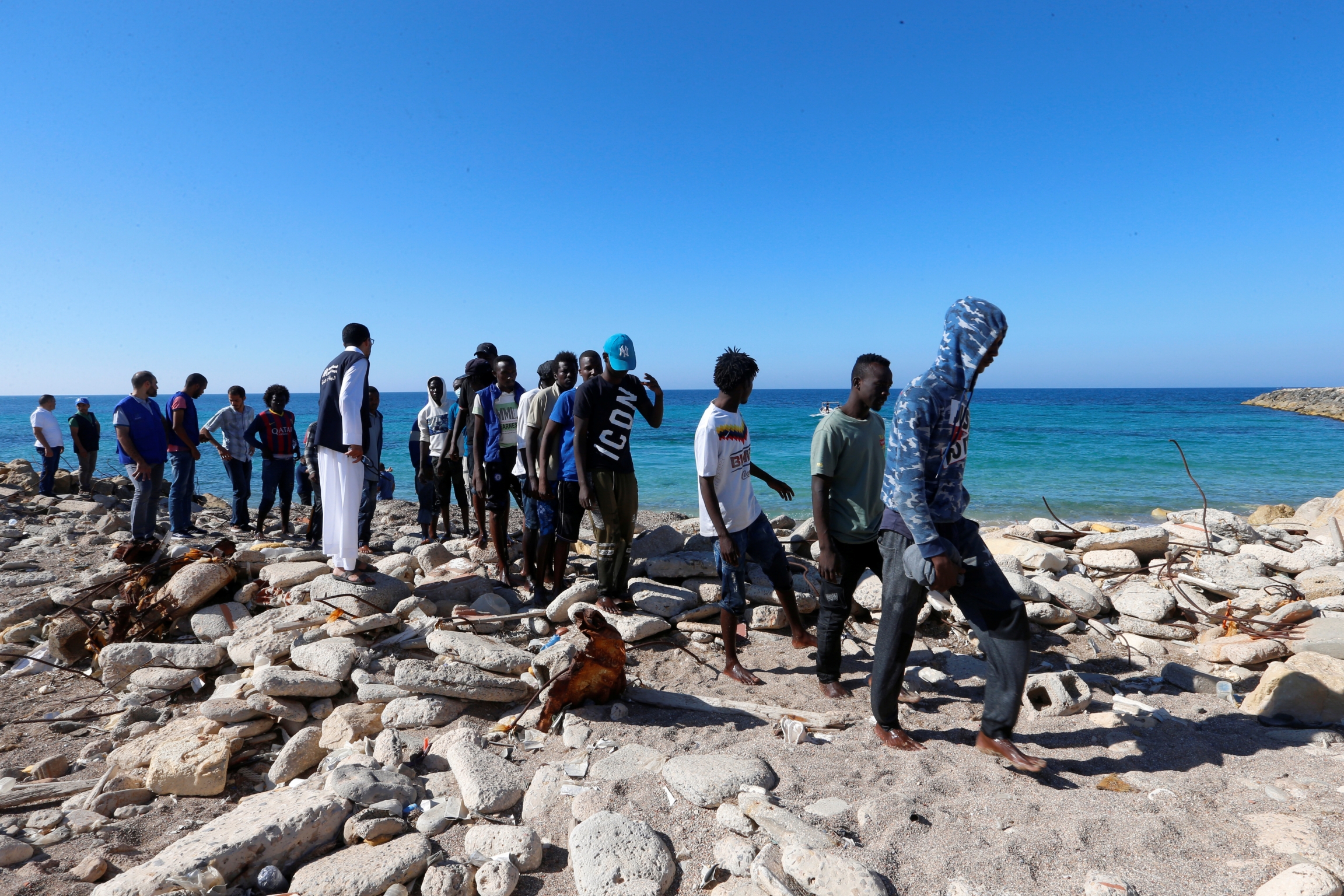 African migrants rescued by Libya coast guard at seashore