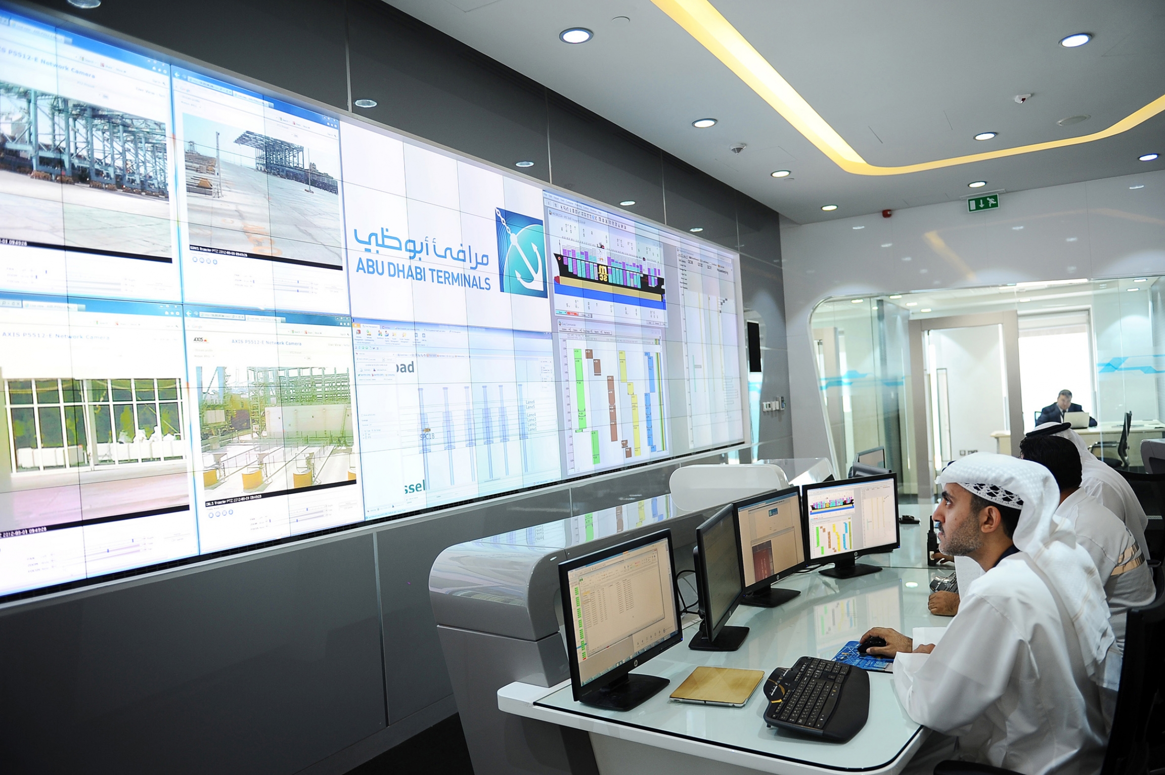 Industrial control rooms like this often contain vulnerable computer systems. Employees work in the control room.