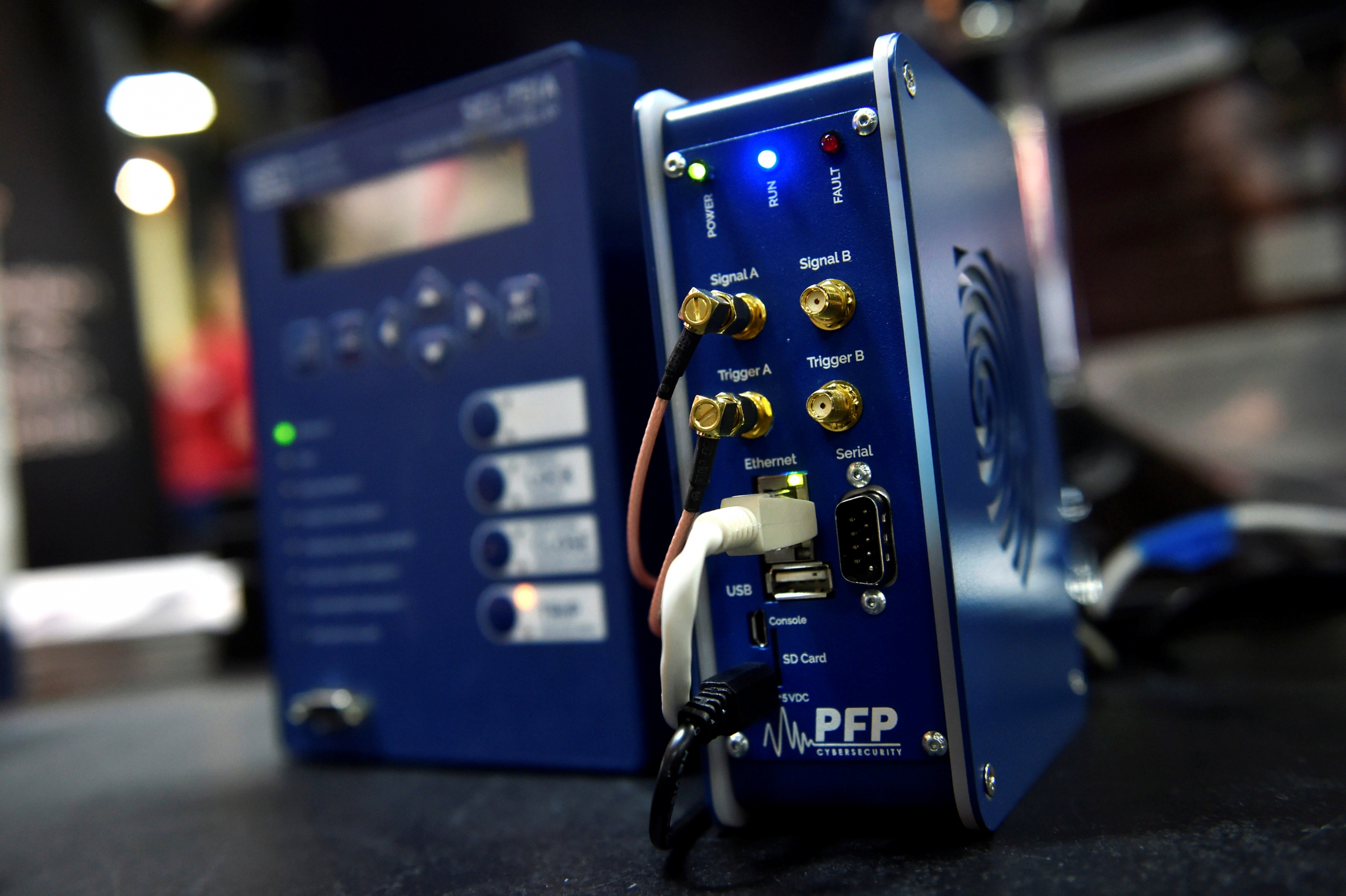 A power grid monitor device is displayed at cyber-security conference. A cyber security device on display.