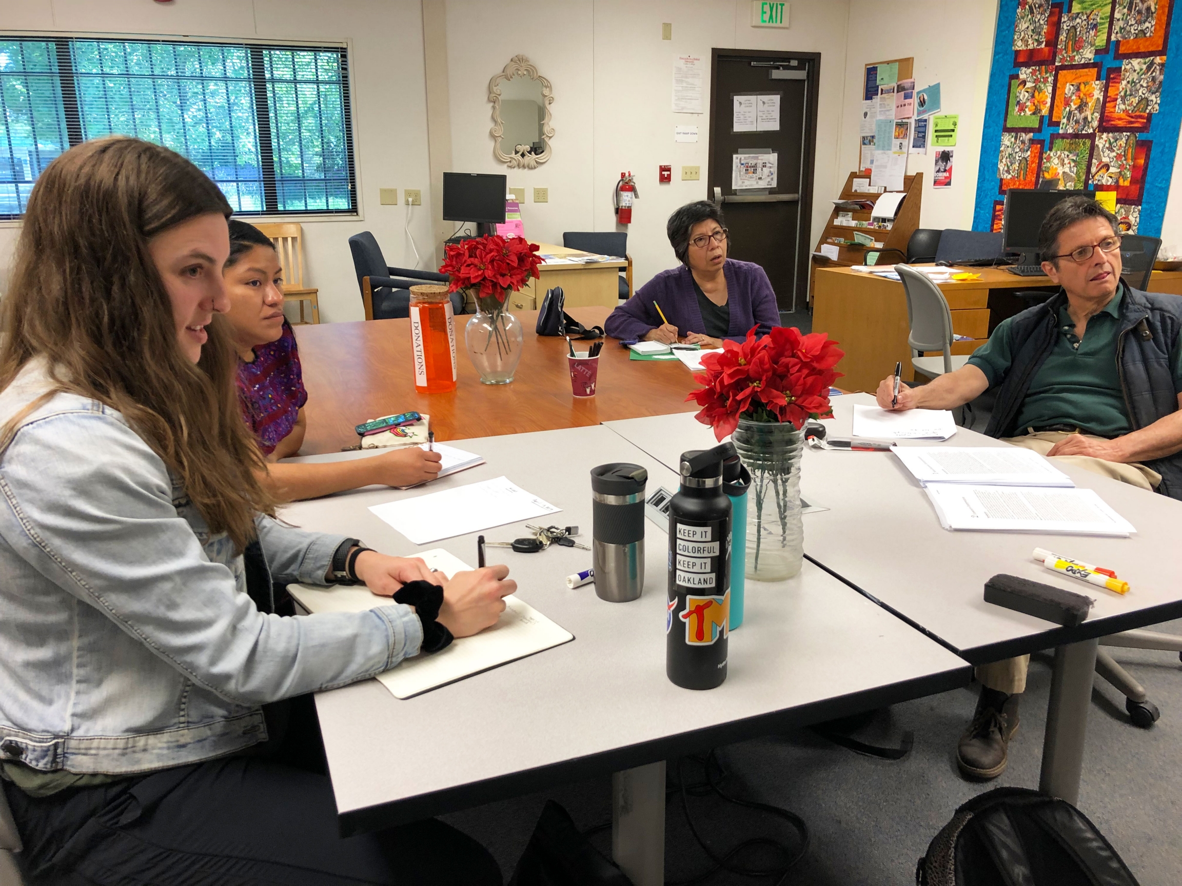 Students sitting around a table.