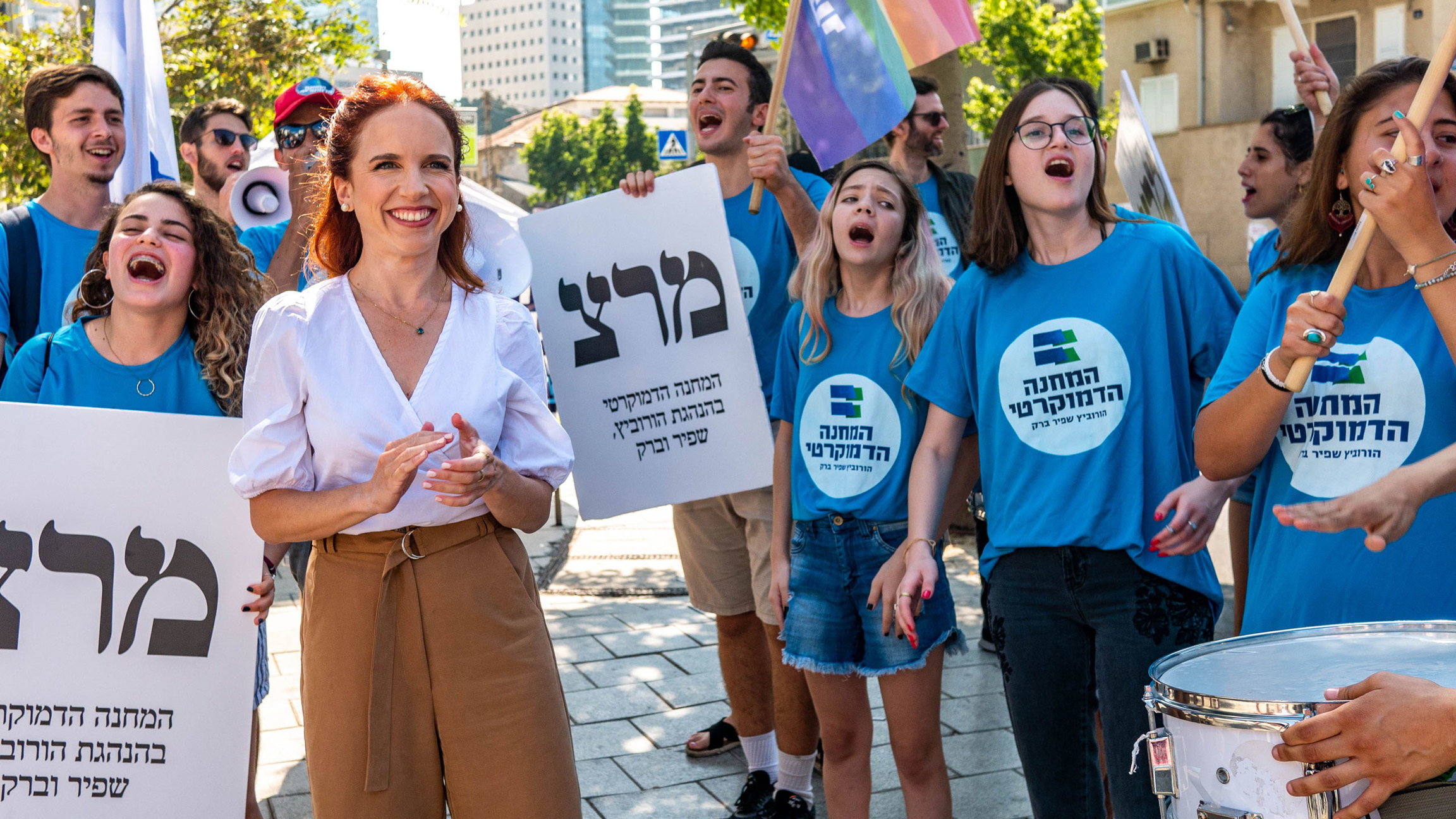A female politician is greeted by supporters