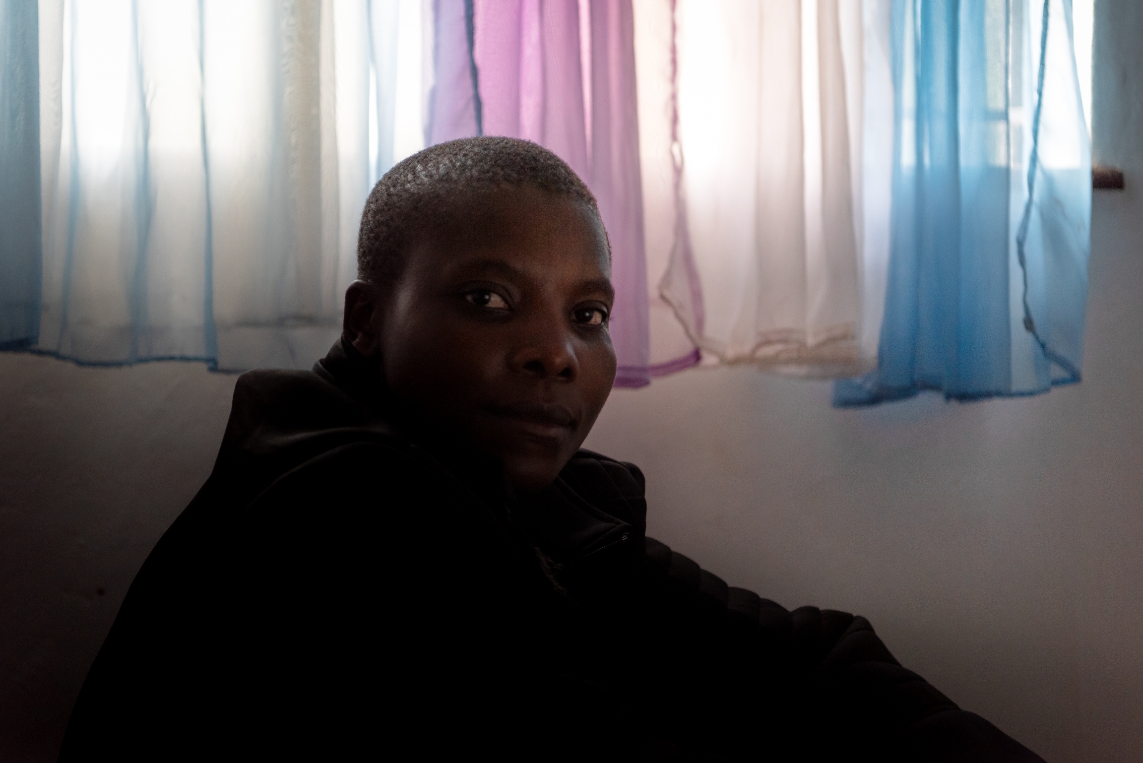A Kenyan man poses for a portrait