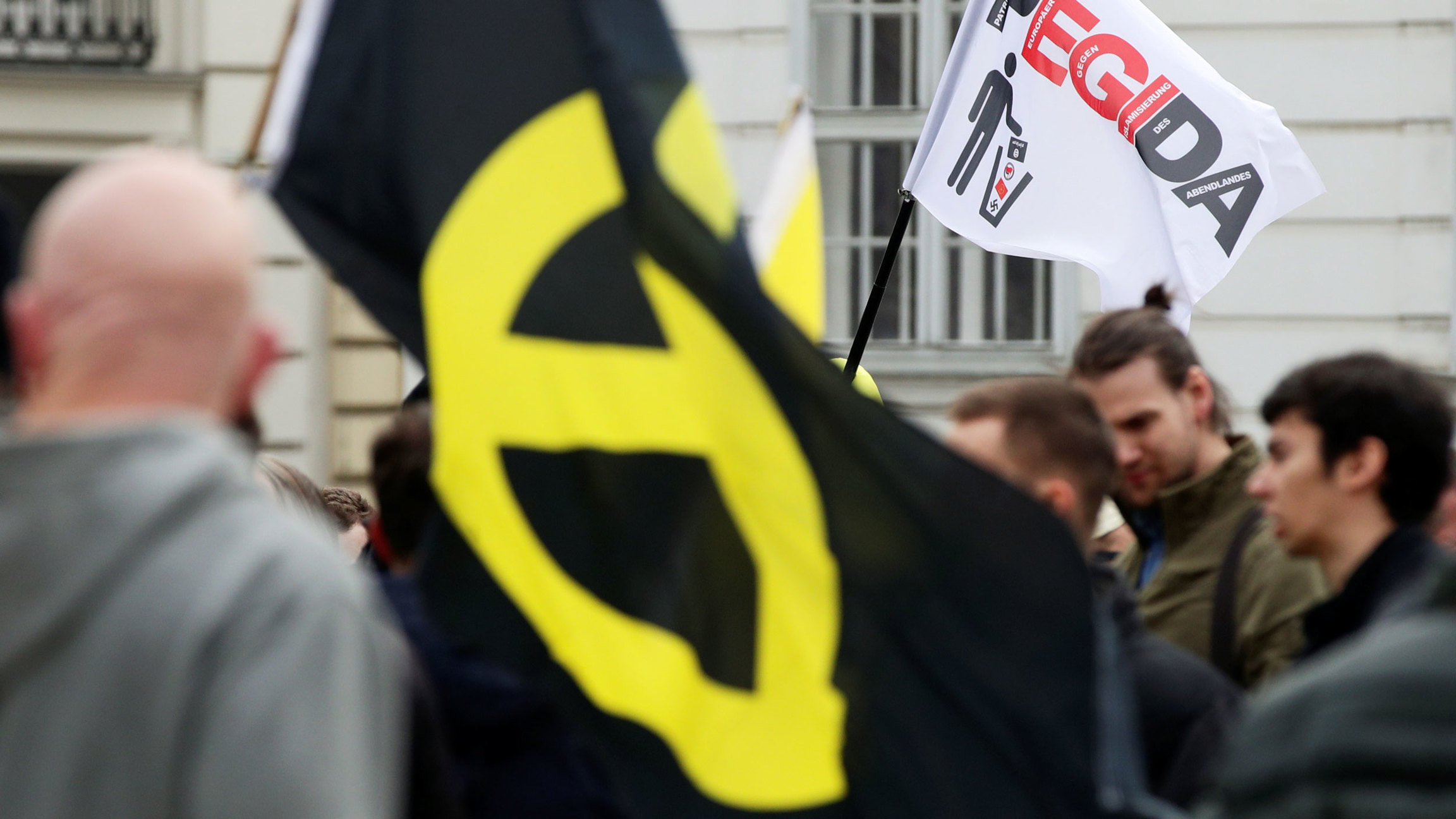 "With Trump, the pride of a whole population has awoken," said the leader of Austria’s Identitarian Party, Martin Sellner, seen at an April 2019 protest where an anti-Islam yellow flag is displayed. "With Trump, the pride of a whole population has awoken," said the leader of Austria’s Identitarian Party, Martin Sellner, seen at an April 2019 protest where an anti-Islam yellow flag is displayed.