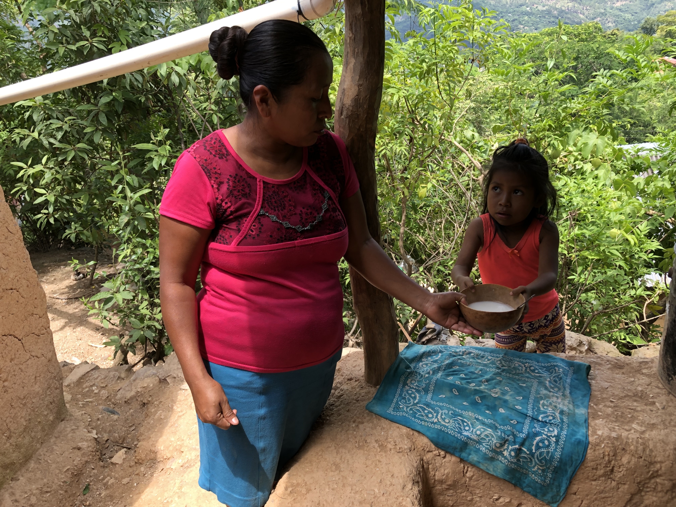 A Guatemalan mother prepares broth for her daughter, whom doctors say is malnourished. A Guatemalan mother prepares broth for her daughter, whom doctors say is malnourished.